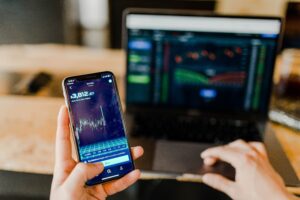 crypto trading on mobilephone and laptop